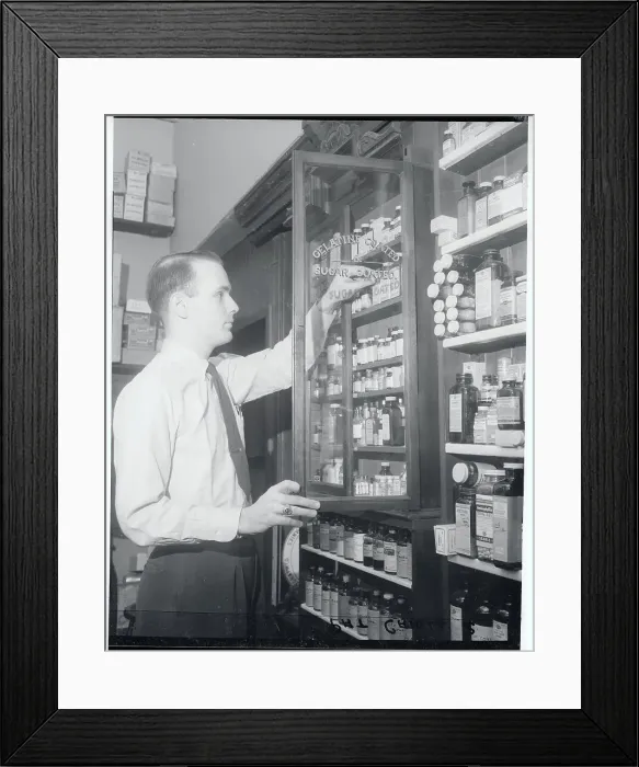 Framed Print : Man Looking Through Drug Cabinet Framed Print : Man Looking Through Drug Cabinet
