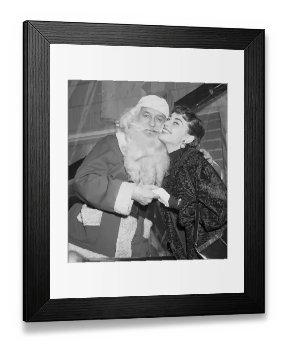 Framed Print : Audrey Hepburn Cheek to Cheek with Santa Claus Framed Print : Audrey Hepburn Cheek to Cheek with Santa Claus