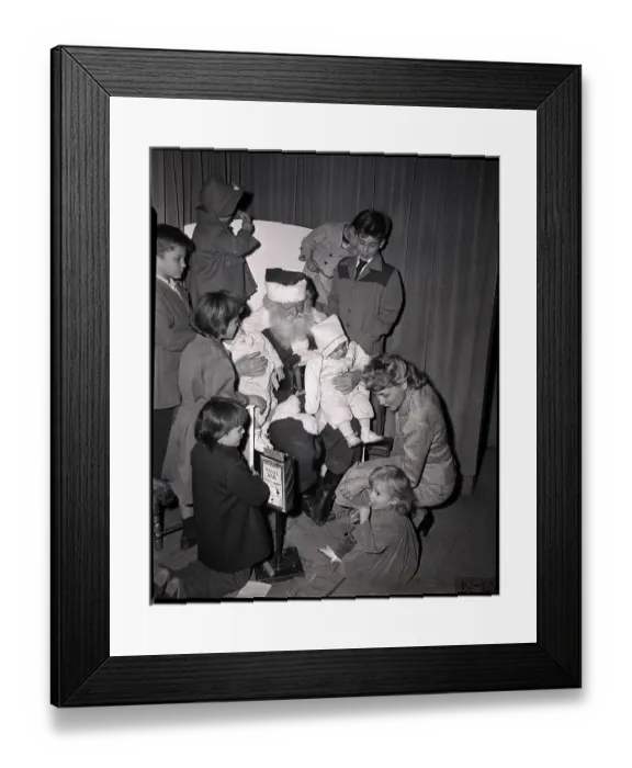 Framed Print : Mother and Children Huddled Around Santa Framed Print : Mother and Children Huddled Around Santa