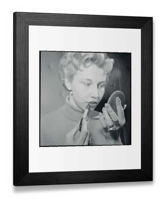 Framed Print : Young Woman with Compact Applying Lipstick Framed Print : Young Woman with Compact Applying Lipstick
