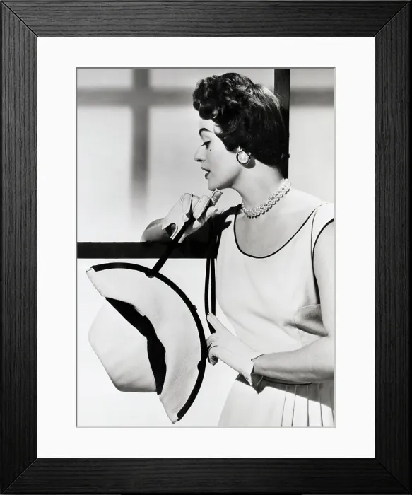Framed Print : Model Manipulates Panama Hat Into A Bag Framed Print : Model Manipulates Panama Hat Into A Bag