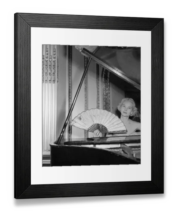 Framed Print : Mrs. Winston Guest Sitting at Piano and Holding Large Fan Framed Print : Mrs. Winston Guest Sitting at Piano and Holding Large Fan
