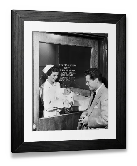 Framed Print : Father Viewing Baby Through Hospital Window Framed Print : Father Viewing Baby Through Hospital Window