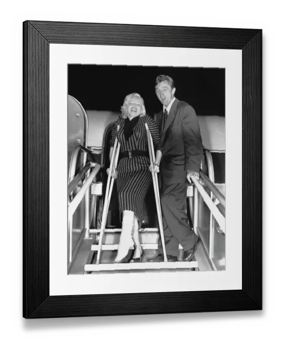 Framed Print : Actress Marilyn Monroe with Actor Robert Mitchum Framed Print : Actress Marilyn Monroe with Actor Robert Mitchum