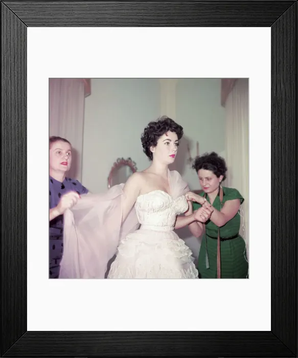 Framed Print : Elizabeth Taylor Having Shawl Placed on her Shoulders Framed Print : Elizabeth Taylor Having Shawl Placed on her Shoulders