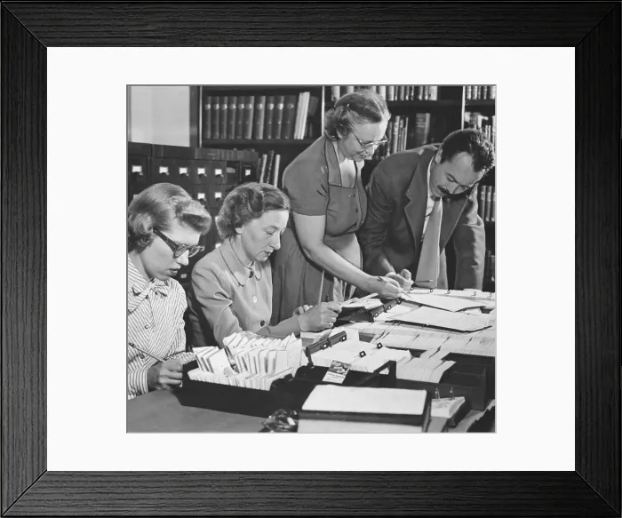 Framed Print : Aides Looking Through Material Framed Print : Aides Looking Through Material