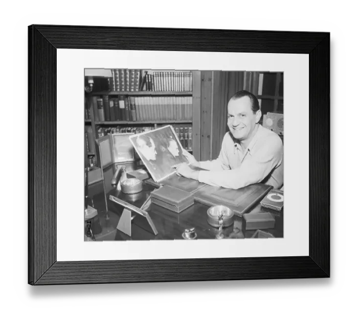 Framed Print : Robert Vogeler at his Desk Holding Photograph Framed Print : Robert Vogeler at his Desk Holding Photograph