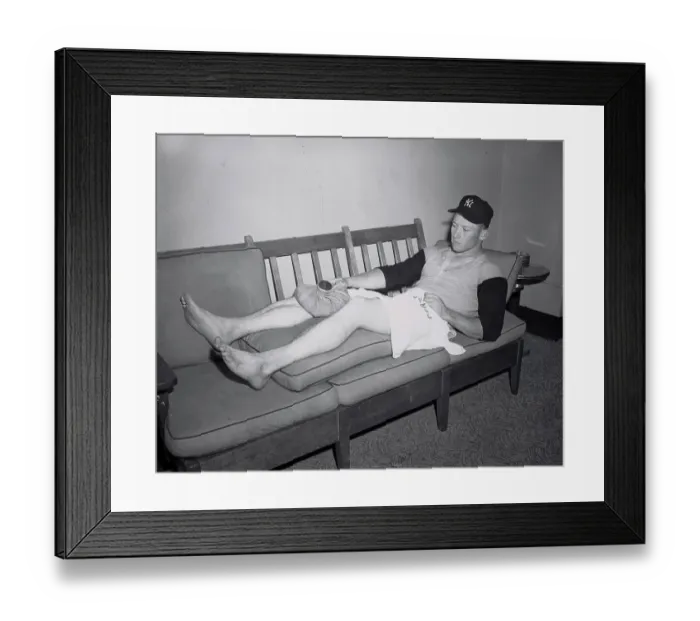 Framed Print : Mickey Mantle Lying on Couch with Covering on Injured Knee Framed Print : Mickey Mantle Lying on Couch with Covering on Injured Knee
