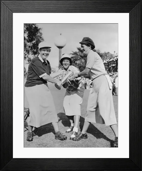 Framed Print : Women Golfers Pulling Golf Trophy Framed Print : Women Golfers Pulling Golf Trophy