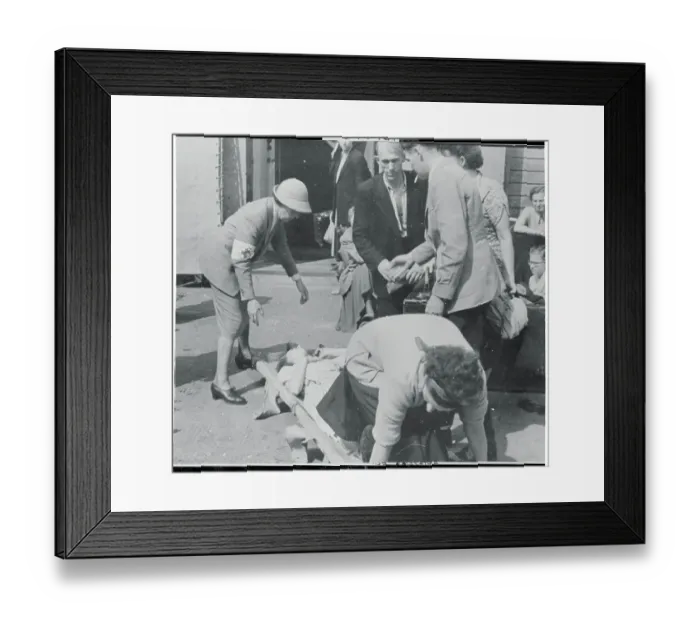 Framed Print : Woman Being Assisted by Medics Framed Print : Woman Being Assisted by Medics