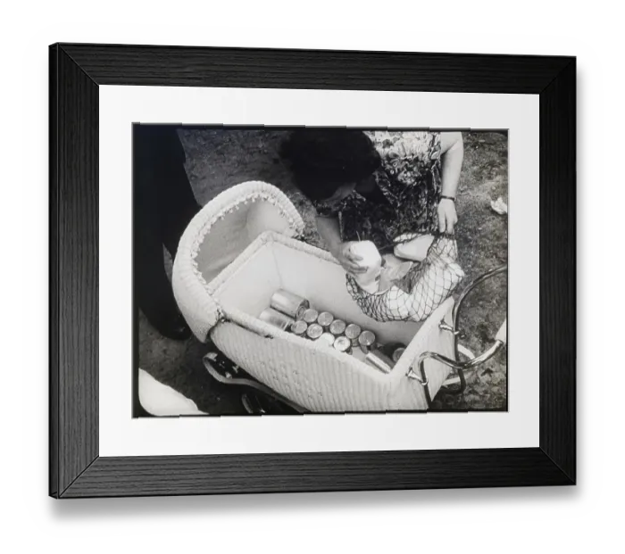 Framed Print : Woman Puts Netted Basket Into Baby Carri Framed Print : Woman Puts Netted Basket Into Baby Carri