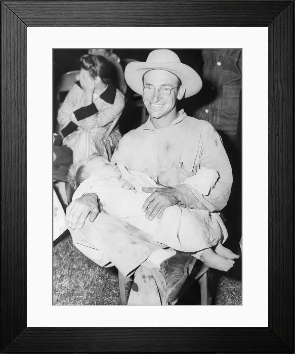 Framed Print : Farmer Holds His 18-Month-Old Son on Lap Framed Print : Farmer Holds His 18-Month-Old Son on Lap