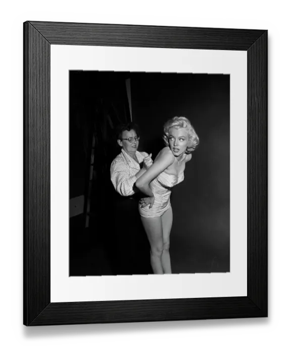 Framed Print : Marilyn Monroe Being Fitted into a Swimsuit Framed Print : Marilyn Monroe Being Fitted into a Swimsuit