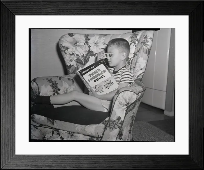 Framed Print : Child In Seat Reading 3D Comic Framed Print : Child In Seat Reading 3D Comic