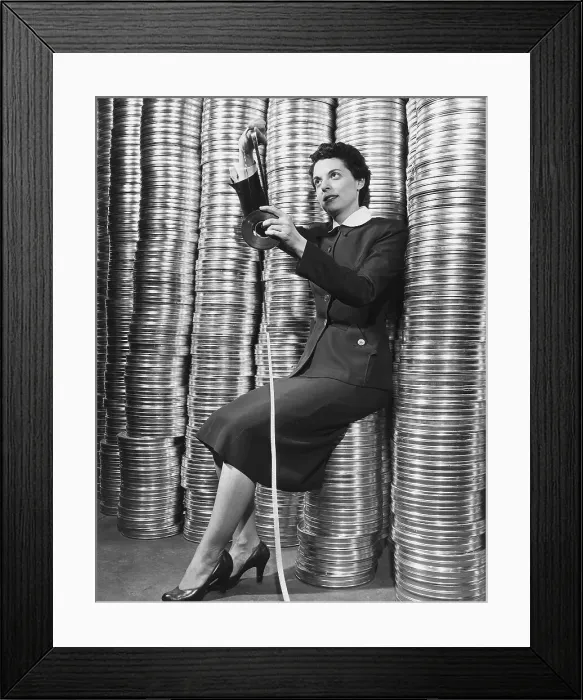 Framed Print : Marcia Drennen Posed W / Film Reel Stacks