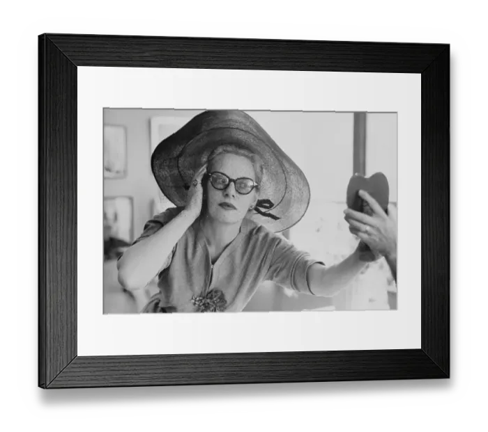 Framed Print : Fluer Cowles Trying on Hat Framed Print : Fluer Cowles Trying on Hat