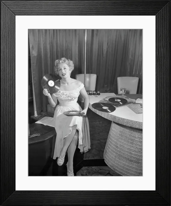 Framed Print : Eva Gabor Holding Records Framed Print : Eva Gabor Holding Records