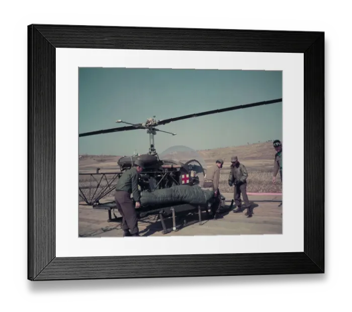 Framed Print : Men Loading POW Soldier Aboard Helicopter Framed Print : Men Loading POW Soldier Aboard Helicopter