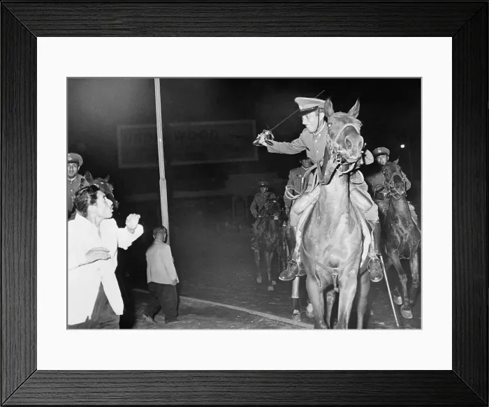 Framed Print : Mounted Policeman Swings Sword at Rioter Framed Print : Mounted Policeman Swings Sword at Rioter