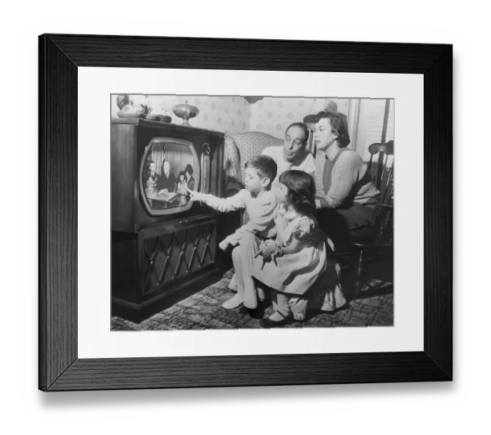 Framed Print : Family Watches Daughter on Television Framed Print : Family Watches Daughter on Television