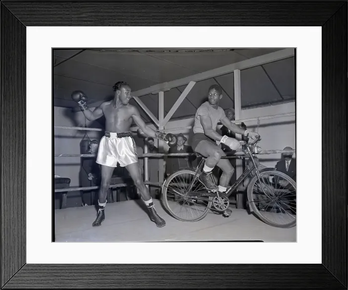 Framed Print : Kid Gavilan In Ring with Man On Bicycle Framed Print : Kid Gavilan In Ring with Man On Bicycle