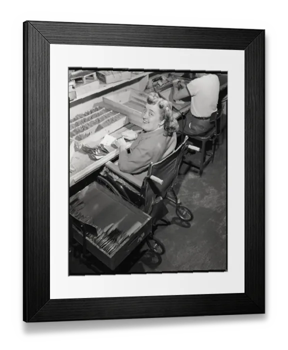 Framed Print : Woman in Wheelchair Looks Up from Work Framed Print : Woman in Wheelchair Looks Up from Work