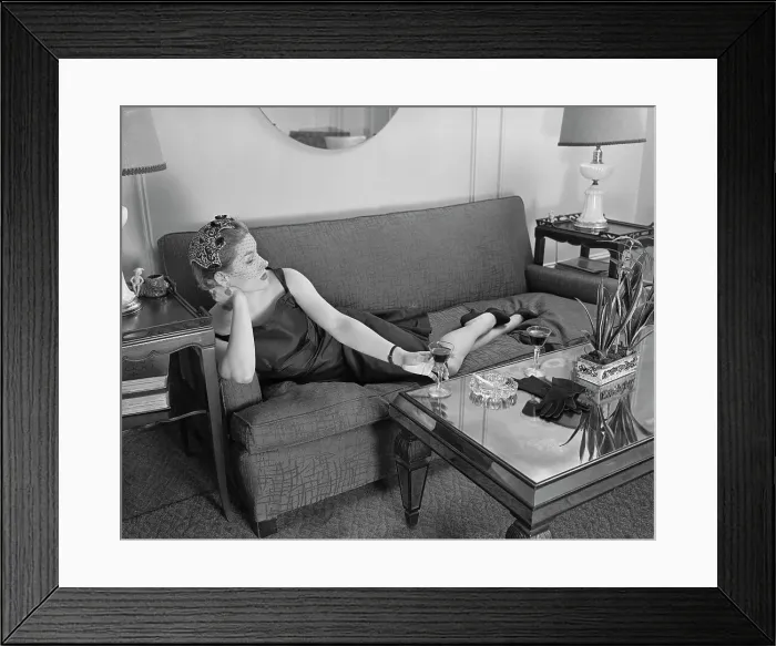 Framed Print : Woman Lounging on Sofa Framed Print : Woman Lounging on Sofa