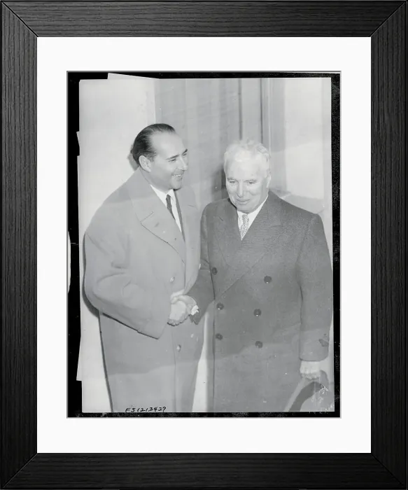 Framed Print : Roberto Rossellini Shaking Hands with Charlie Chaplin Framed Print : Roberto Rossellini Shaking Hands with Charlie Chaplin