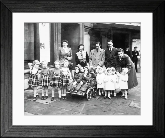 Framed Print : Parents And Three Sets Of Quadruplets Framed Print : Parents And Three Sets Of Quadruplets