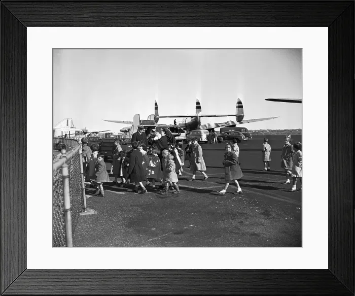 Framed Print : Children Leving Plane At Airport Framed Print : Children Leving Plane At Airport