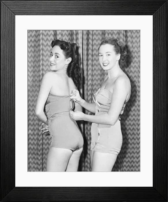 Framed Print : Women In Undergarments Testing New Zipper Framed Print : Women In Undergarments Testing New Zipper