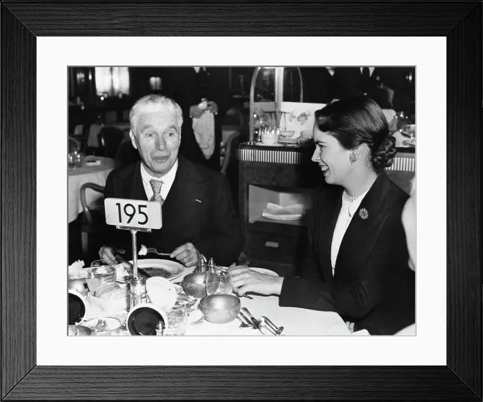 Framed Print : Charlie Chaplin Dining with Oona Chaplin Framed Print : Charlie Chaplin Dining with Oona Chaplin
