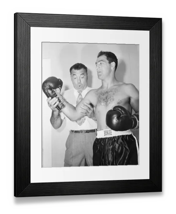Framed Print : Jack Dempsey Looking Rocky Marciano's Arm Framed Print : Jack Dempsey Looking Rocky Marciano's Arm