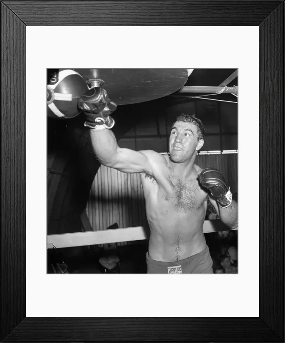 Framed Print : Rocky Marciano Hitting Punching Bag