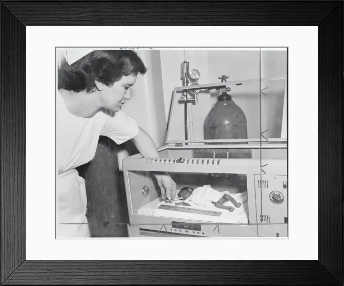 Framed Print : Nure Feeding Premature Baby