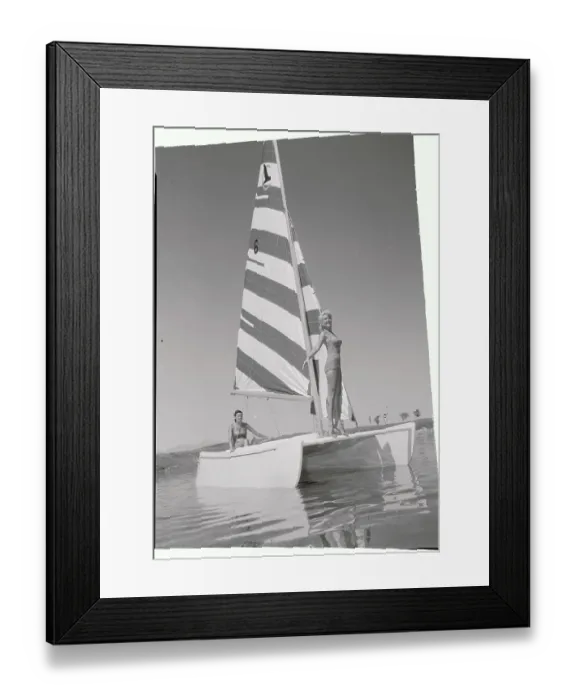 Framed Print : Young Women Posing on Sailboat in Waters Framed Print : Young Women Posing on Sailboat in Waters