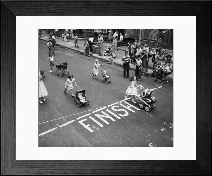 Framed Print : Girls Pushing Toy Carriage Across Finish Framed Print : Girls Pushing Toy Carriage Across Finish
