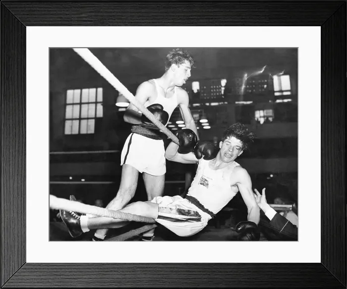 Framed Print : Boxer Knocked Out of Ring at Olympics Framed Print : Boxer Knocked Out of Ring at Olympics