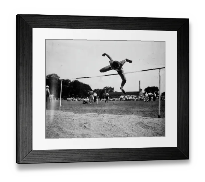 Framed Print : Woman Clearing Bar In High Jump