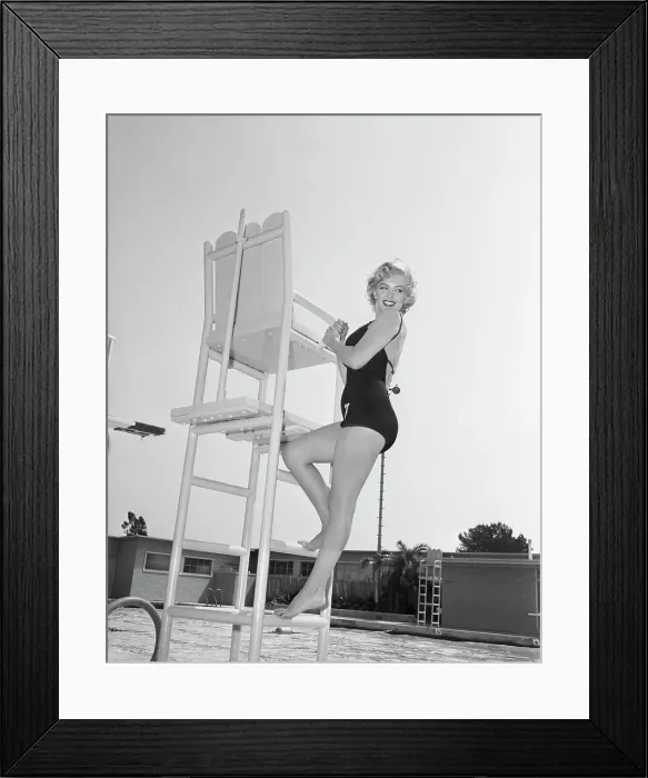 Framed Print : Marilyn Monroe Climbing Lifeguard Tower