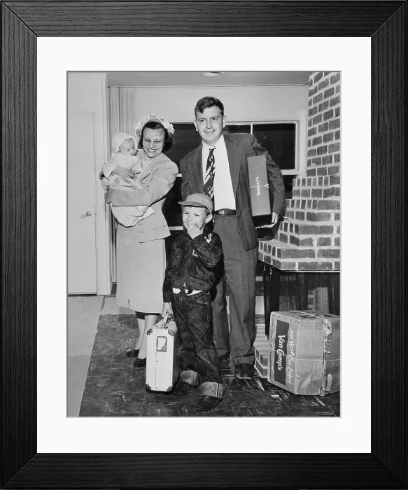 Framed Print : Family Standing near Their Fireplace Framed Print : Family Standing near Their Fireplace