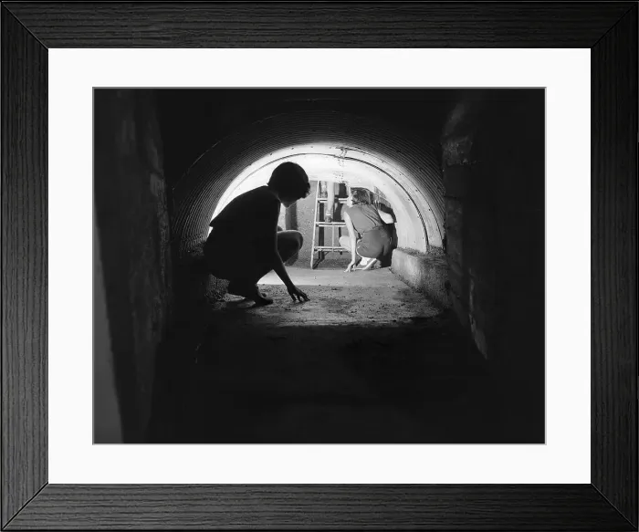 Framed Print : Family Escaping in a Tunnel Framed Print : Family Escaping in a Tunnel