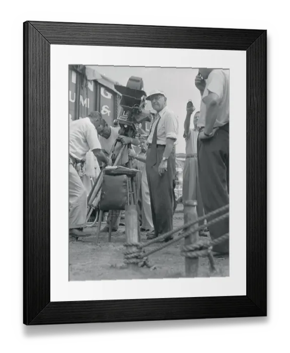 Framed Print : Cecil B. Demille Standing in Front of a Movie Camera Framed Print : Cecil B. Demille Standing in Front of a Movie Camera