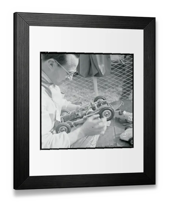 Framed Print : Man Inspecting Miniature Car Framed Print : Man Inspecting Miniature Car