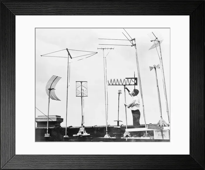 Framed Print : Technician Adjusting Television Antennae on Roof Framed Print : Technician Adjusting Television Antennae on Roof