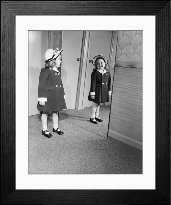 Framed Print : Girl Looking at Easter Outfit in Mirror Framed Print : Girl Looking at Easter Outfit in Mirror