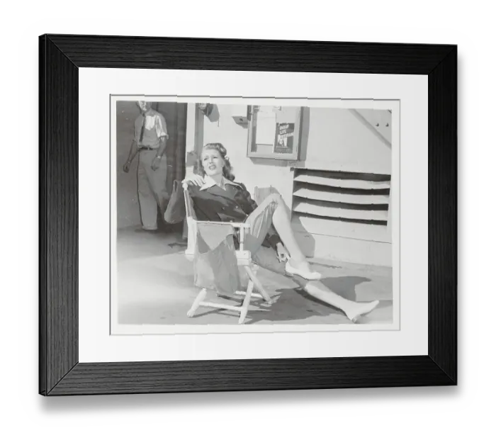 Framed Print : Rita Hayworth Resting on Film Set
