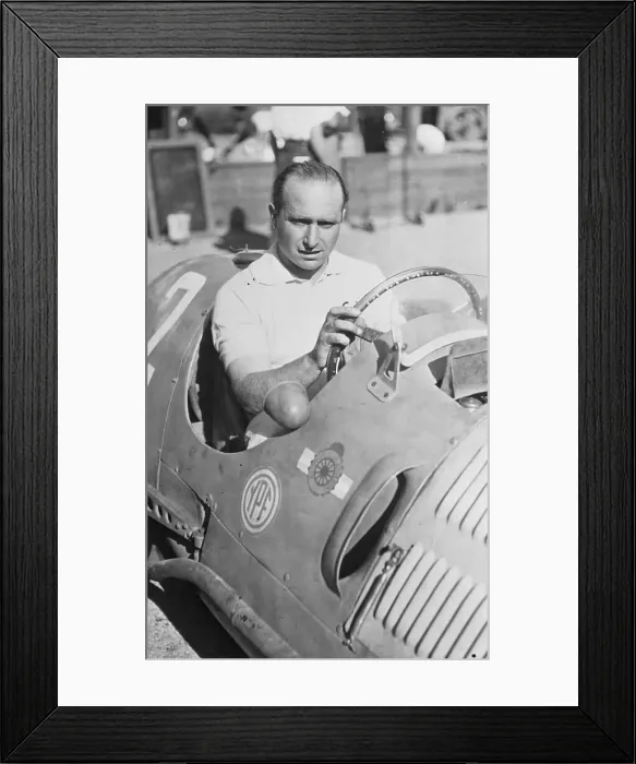 Framed Print : Juan Manuel Fangio Sitting in Race Car Framed Print : Juan Manuel Fangio Sitting in Race Car