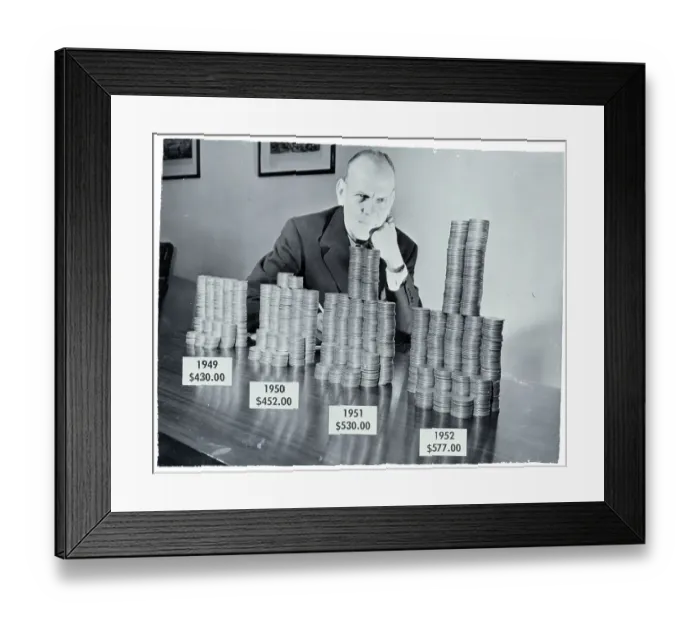 Framed Print : Man Seated W / Coins Representing Tax Incr Framed Print : Man Seated W / Coins Representing Tax Incr