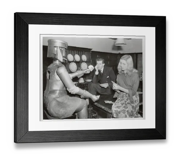 Framed Print : Denis Hamilton Playing Cards with His Wife and a Robot